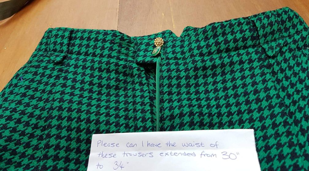 vintage green and black houndstooth wool trousers that need an alteration