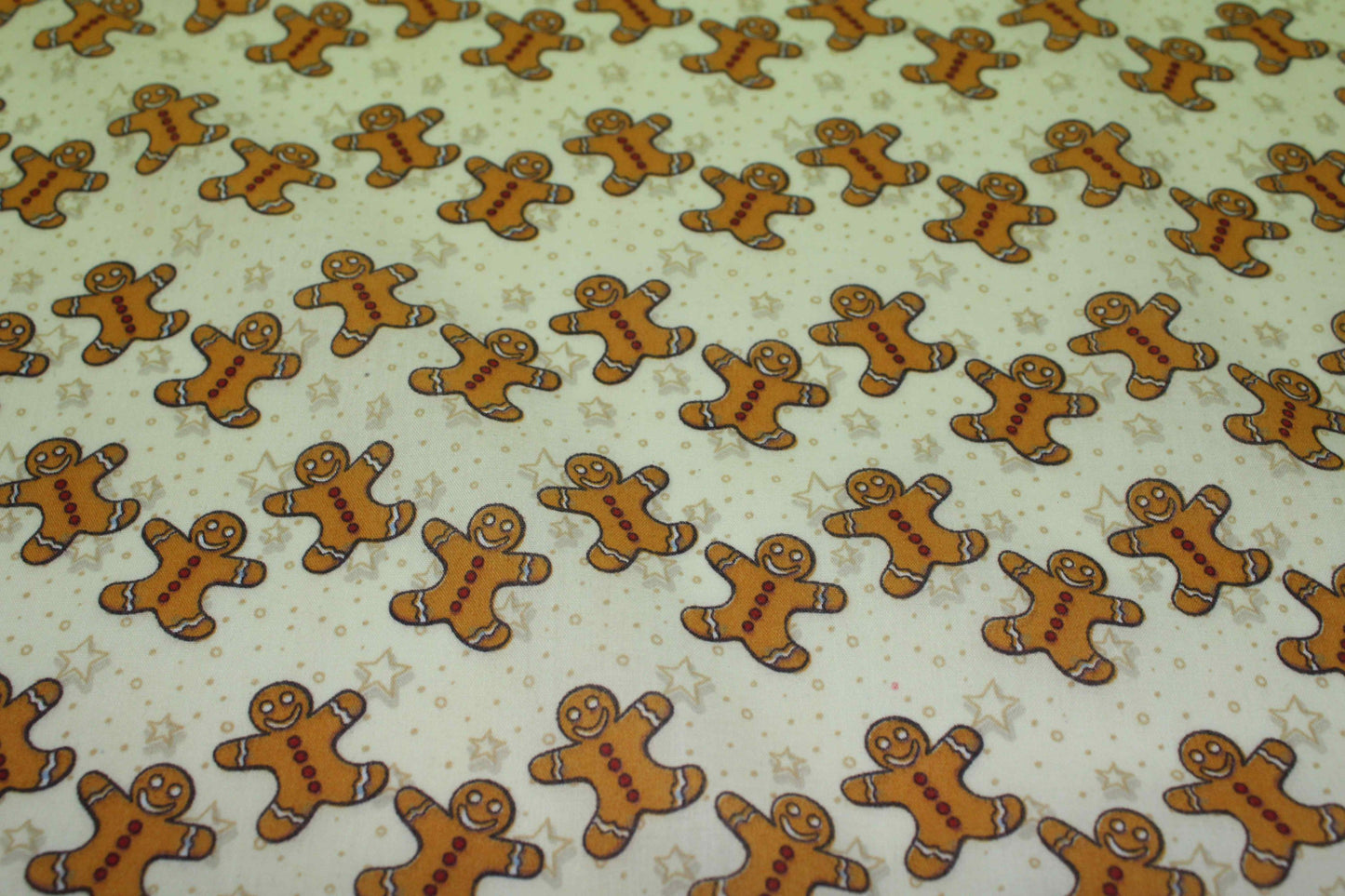 image of gingerbread men on yellow background fabric
