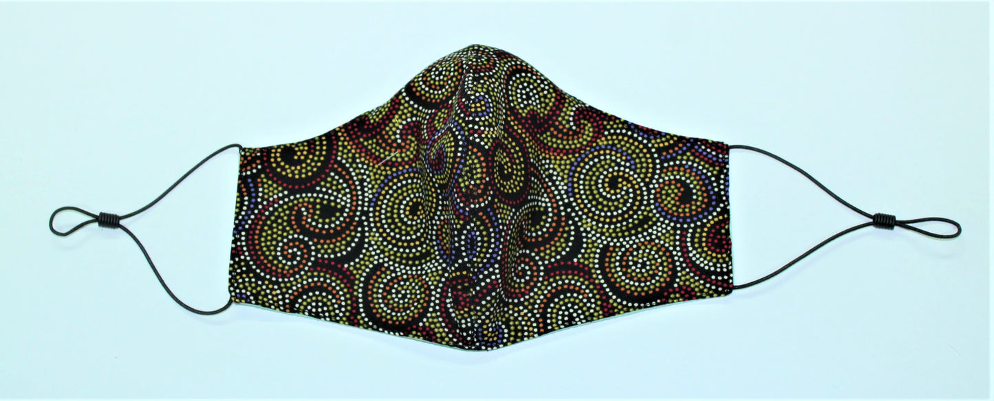 shaped 3-layered cotton facemask with adjusters in green, orange ethnic dot painted swirls
