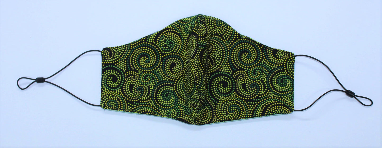 shaped 3-layered cotton facemask in green ethnic dot painted swirls