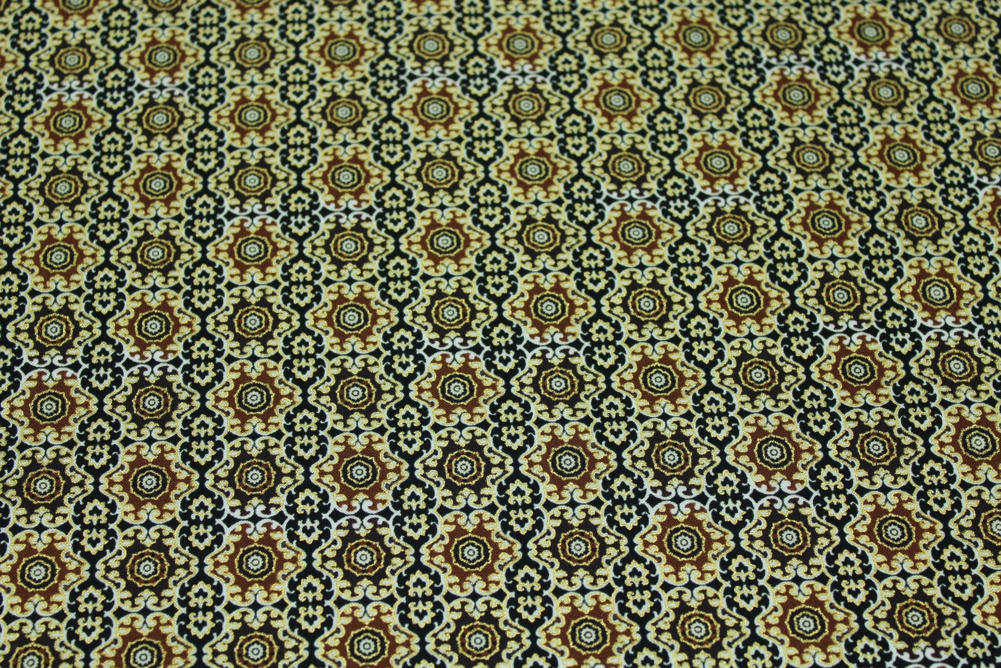 Black/brown/beige maroccan inspired goldedged cotton fabric intricate pattern