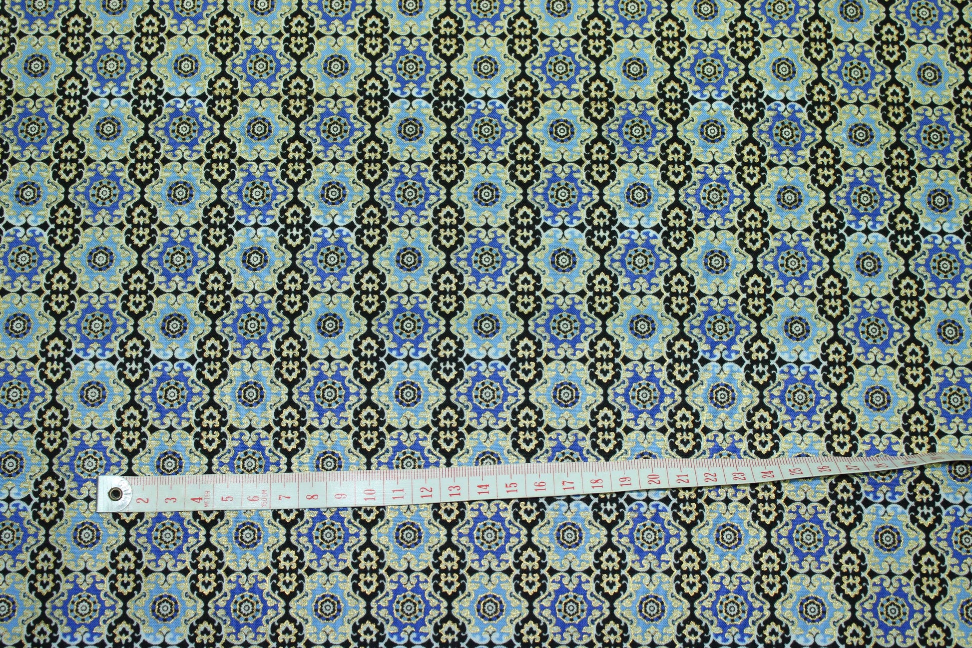 goldedged intricate moroccan patterned cotton print in blues and black
